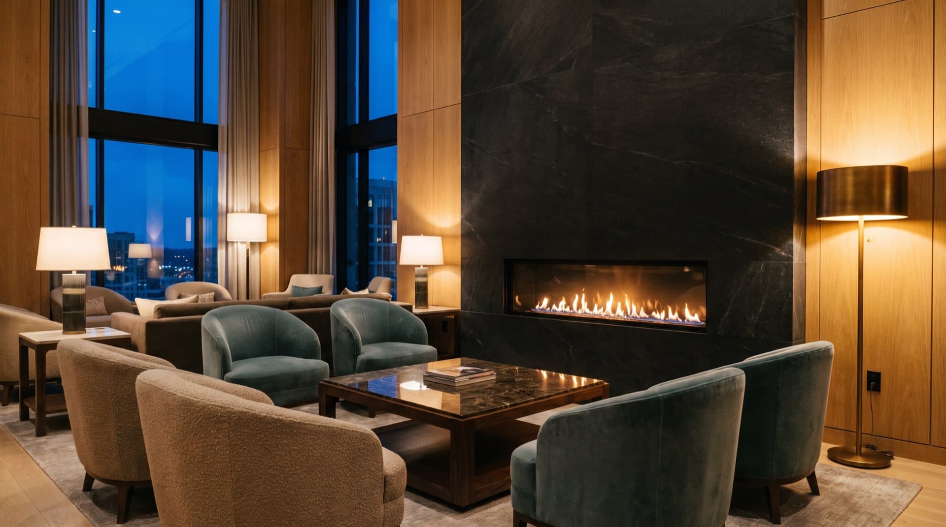 Fireside lounge seating in a hotel lobby at evening