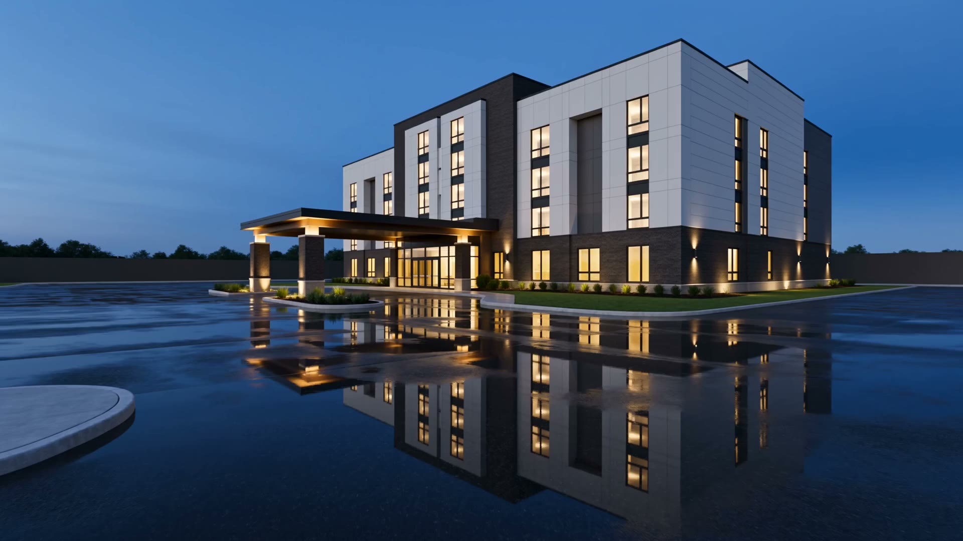 A newly completed select-service hotel at dusk, windows lit